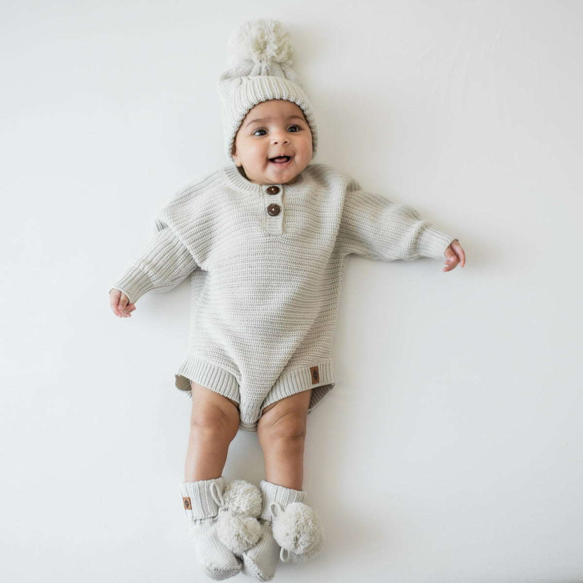 Kyte Baby Chunky Cable Knit Beanie in Oat