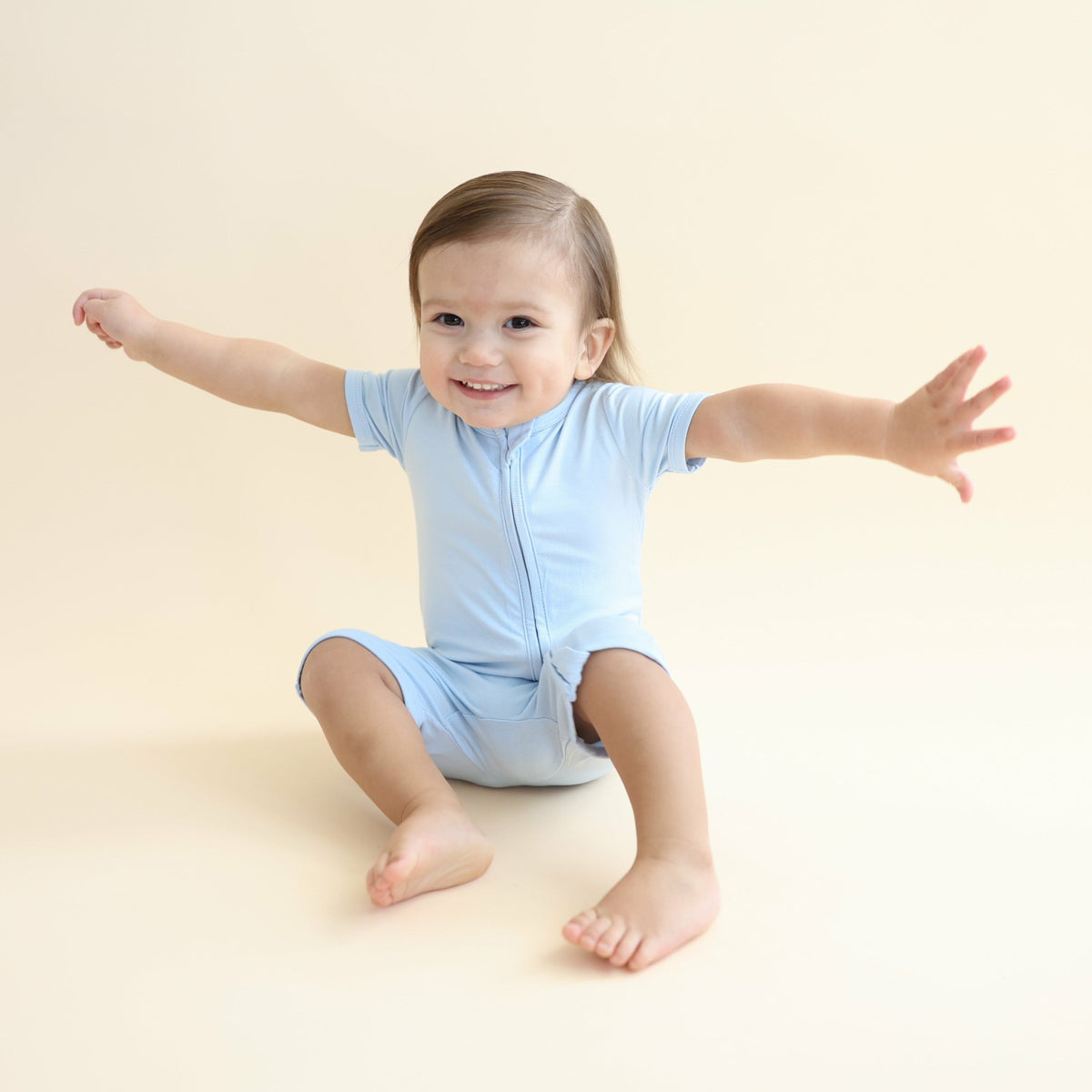 Kyte Baby Zipper Shortall Romper in Breeze