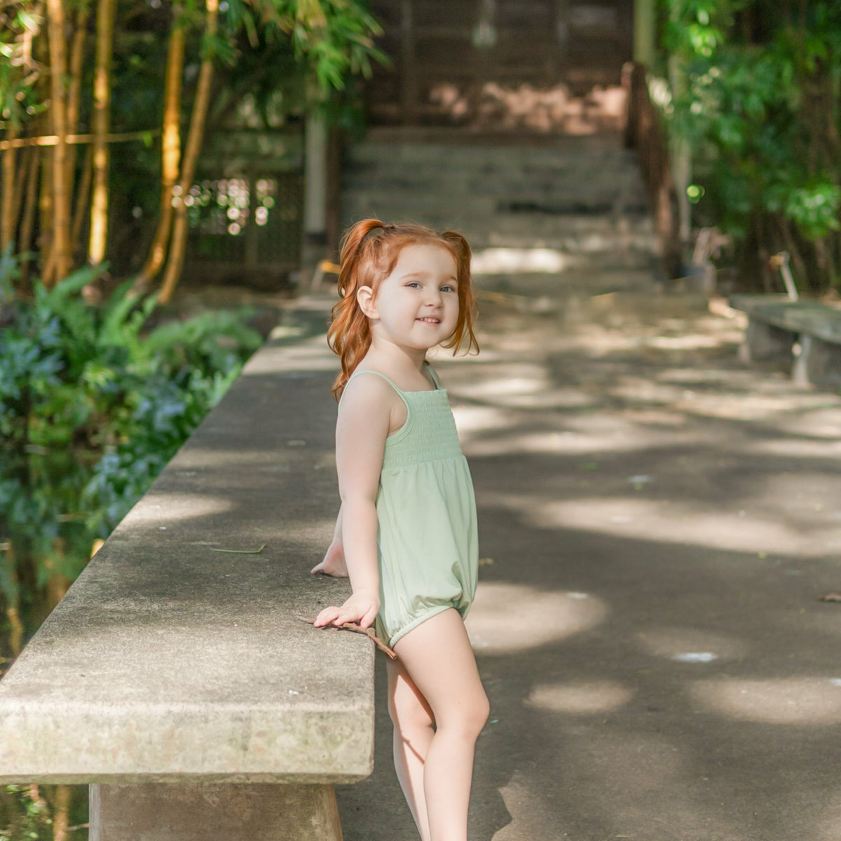 Kyte Baby Smocked Bubble Romper in Basil