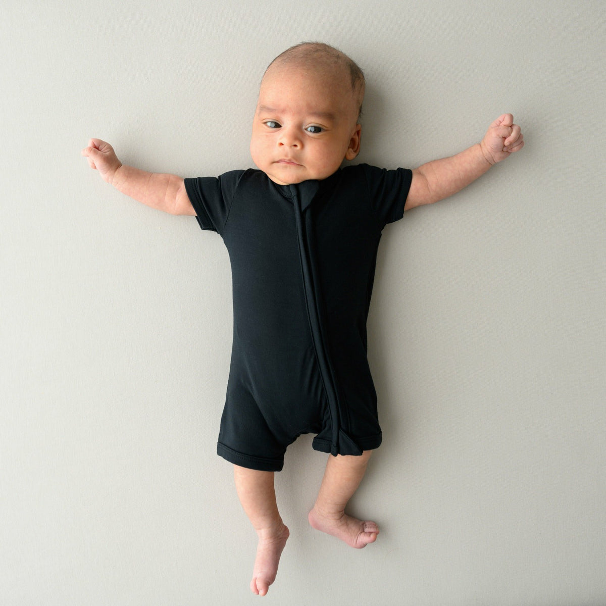 Kyte Baby Zippered Shortall Romper in Midnight