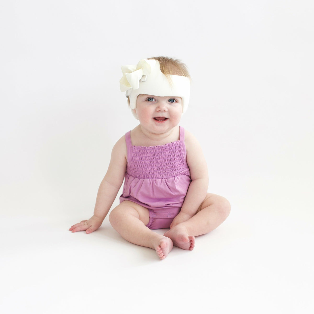 Kyte Baby Smocked Bubble Romper in Poi