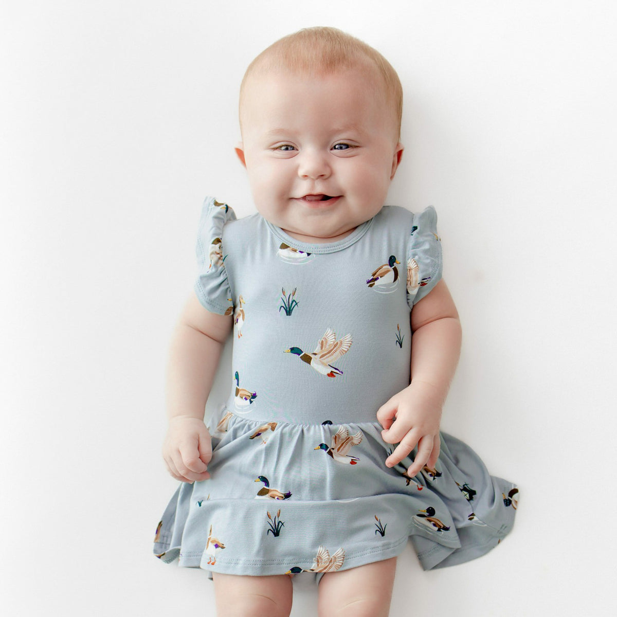 Kyte Baby Twirl Bodysuit Dress in Mallard Duck