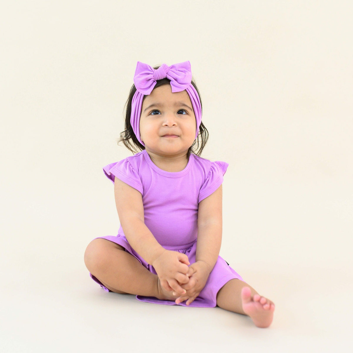 Kyte Baby Twirl Bodysuit Dress in Poi