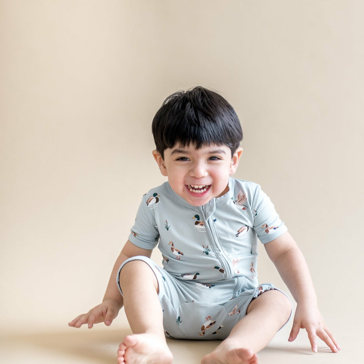 Kyte Baby Zipper Shortall Romper in Mallard Duck