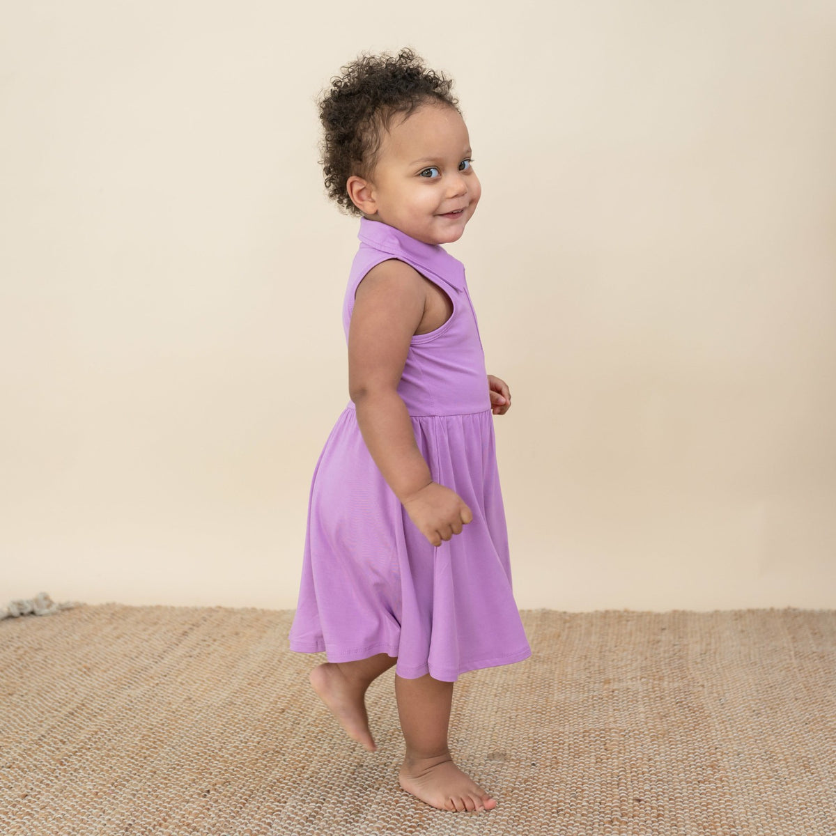 Kyte Baby Polo Bodysuit Dress in Poi