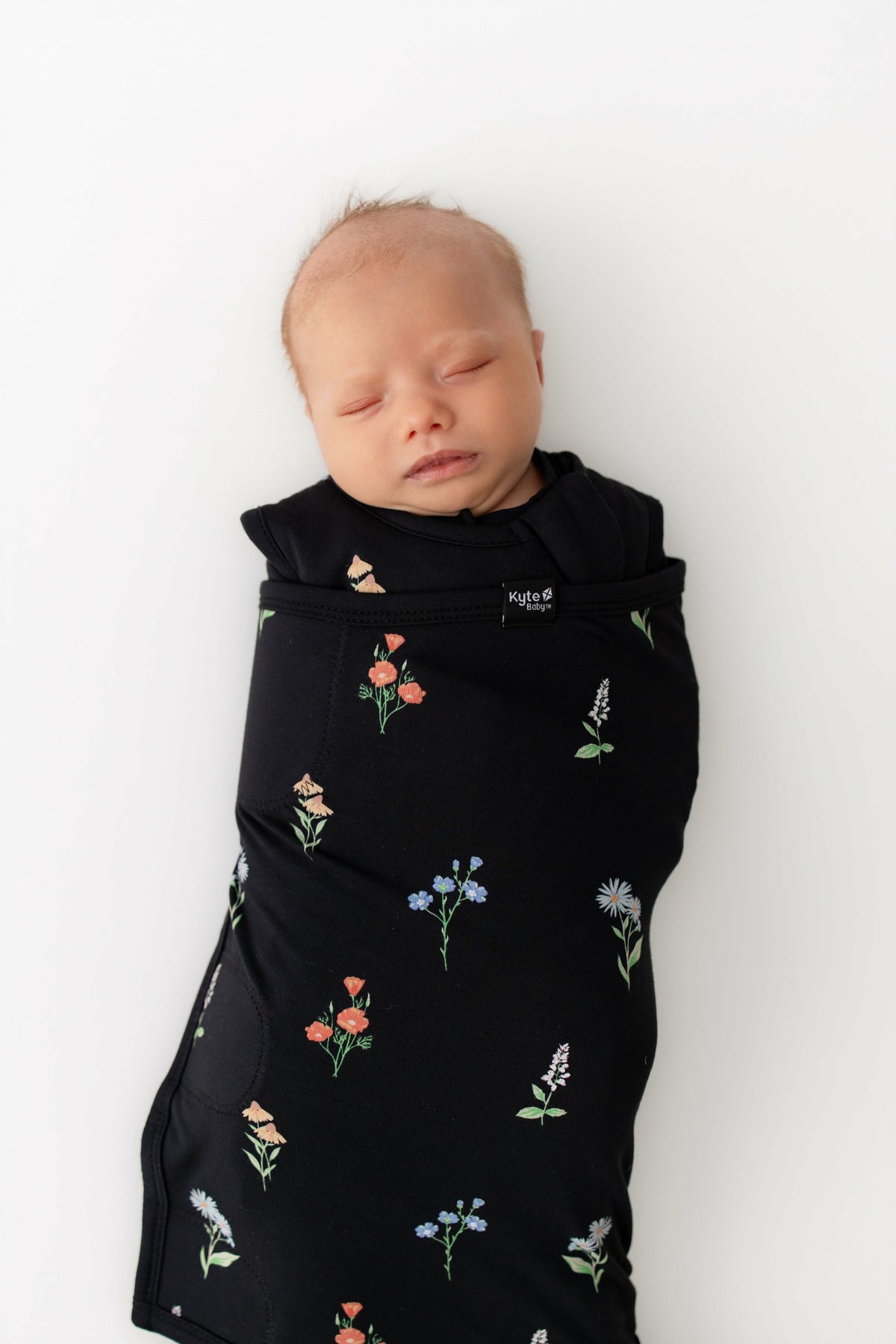 Kyte Baby Sleep Bag Swaddler in Midnight Wildflower 1.0