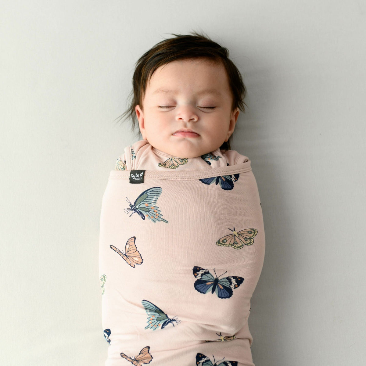 Kyte Baby Sleep Bag Swaddler in Blush Butterfly 0.5