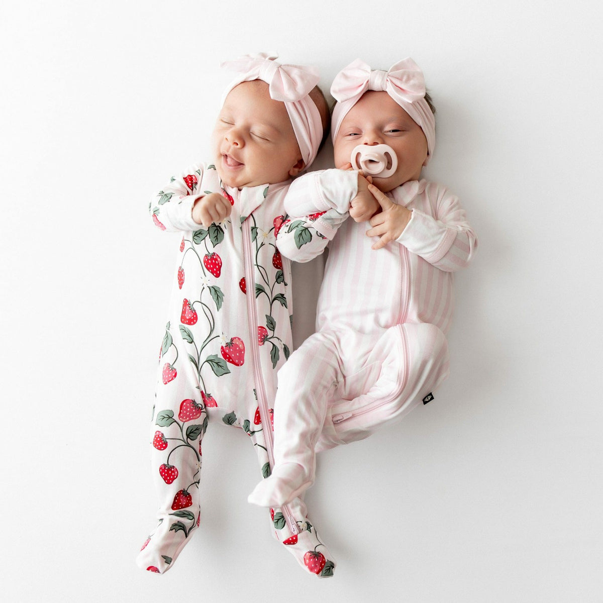 Kyte Baby Zippered Footie in Small Sakura Stripe