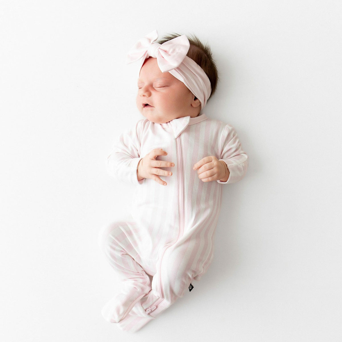 Kyte Baby Zippered Footie in Small Sakura Stripe
