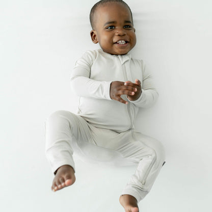 Kyte Baby Zippered Romper in Oat