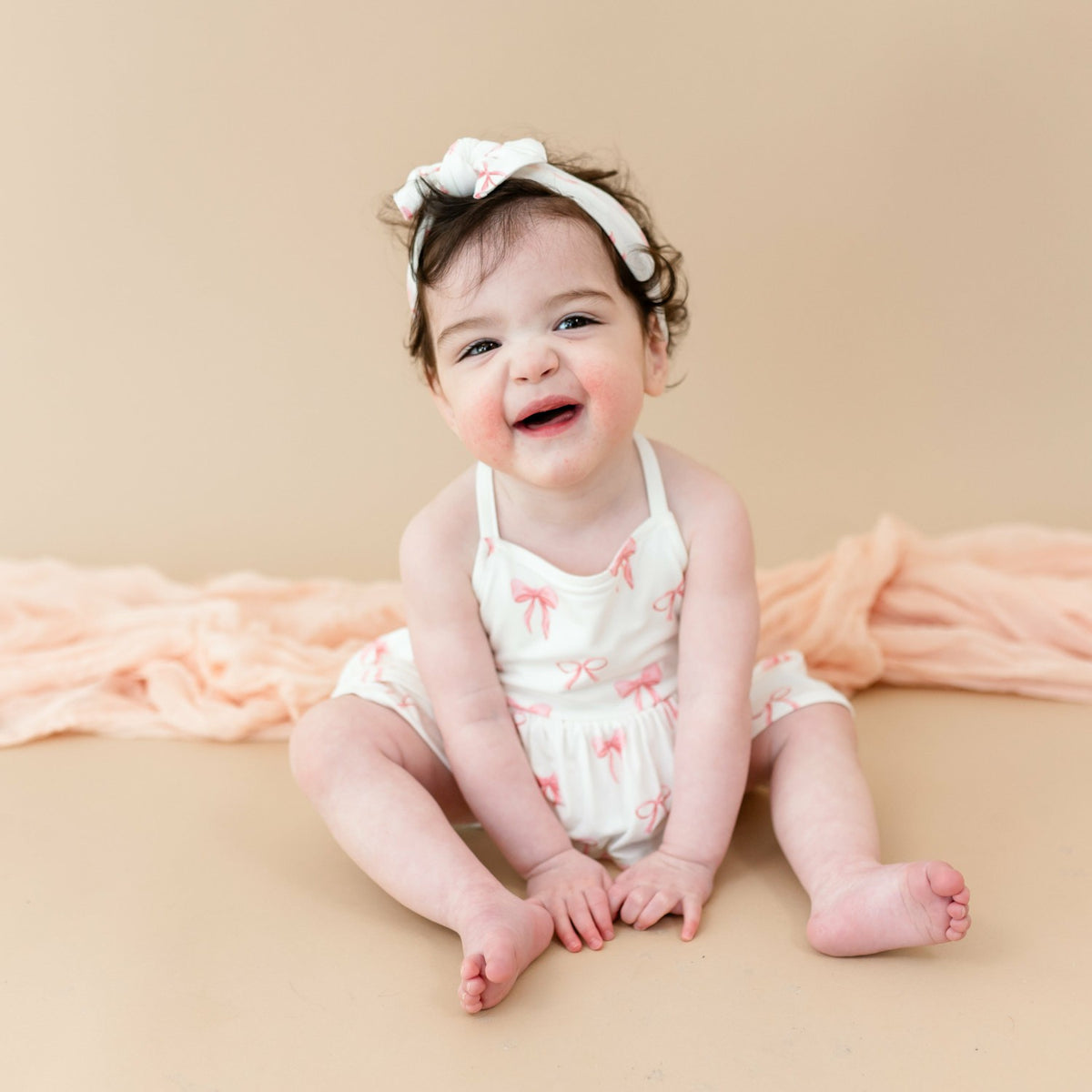 Kyte Baby Spaghetti Strap Ruffle Romper in Bow