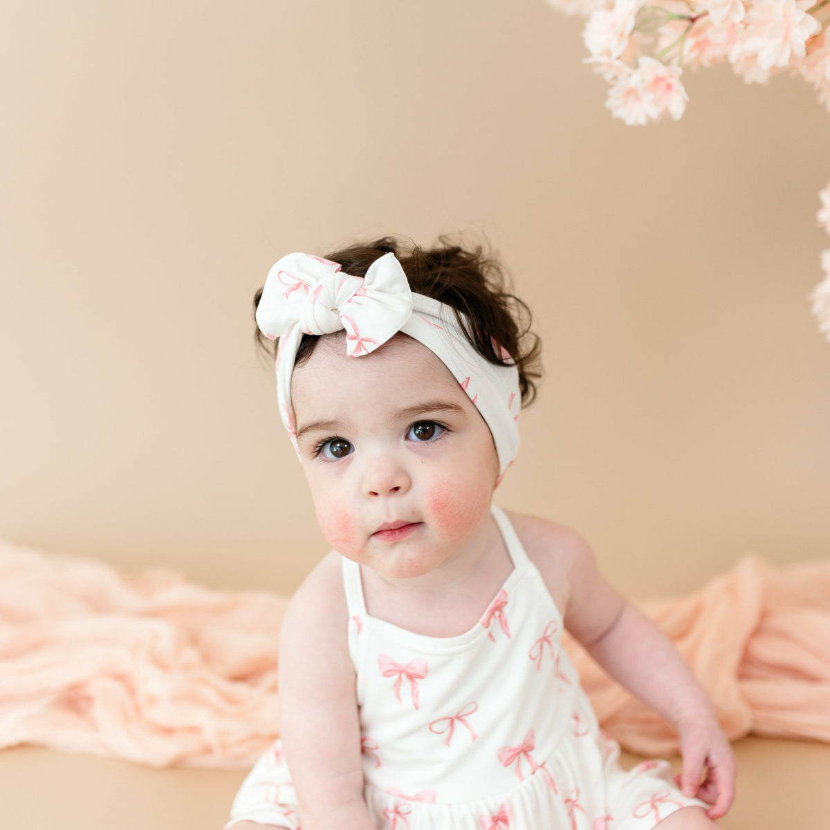 Kyte Baby Spaghetti Strap Ruffle Romper in Bow
