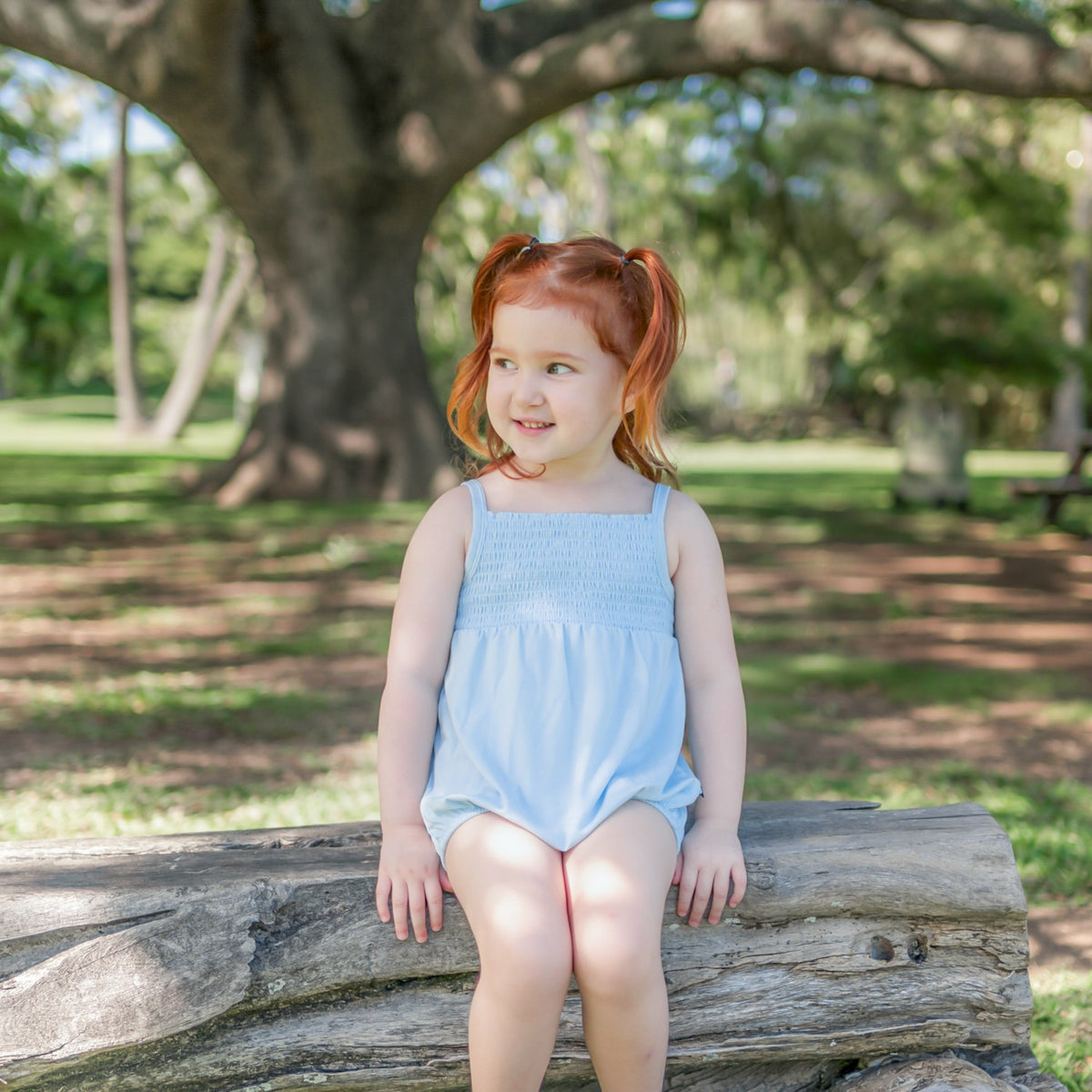 Kyte Baby Smocked Bubble Romper in Breeze