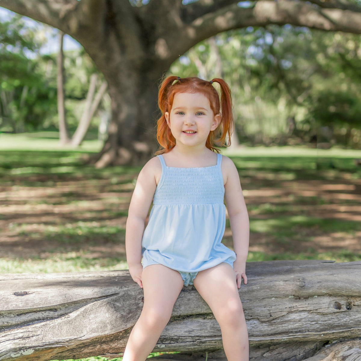 Kyte Baby Smocked Bubble Romper in Breeze