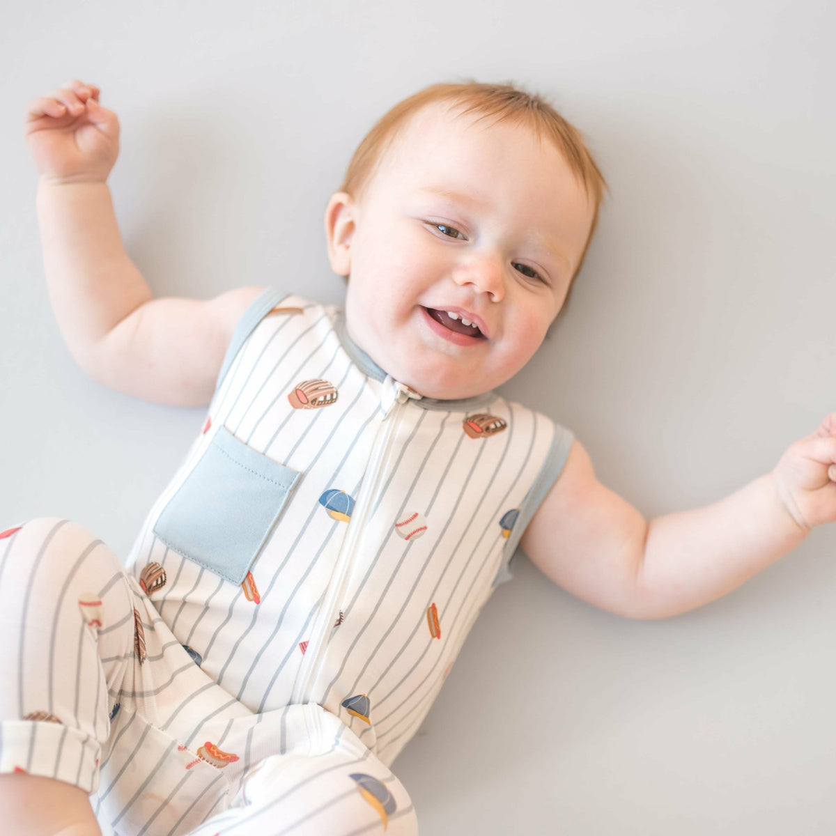 Kyte Baby Zippered Sleeveless Romper in Home Run