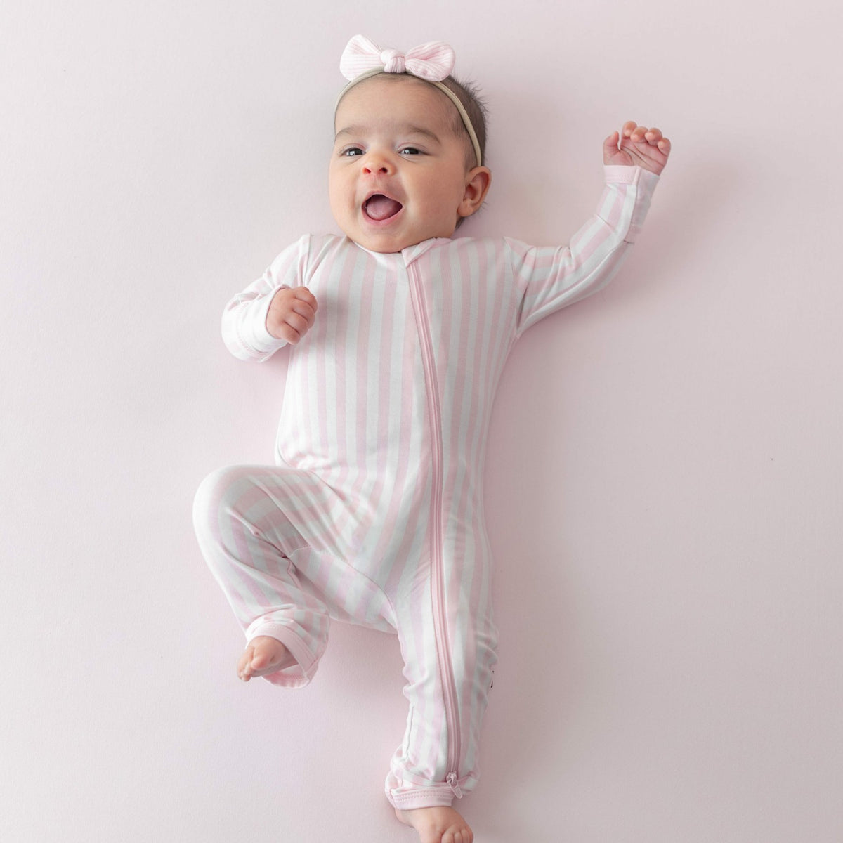 Kyte Baby Zippered Romper in Small Sakura Stripe