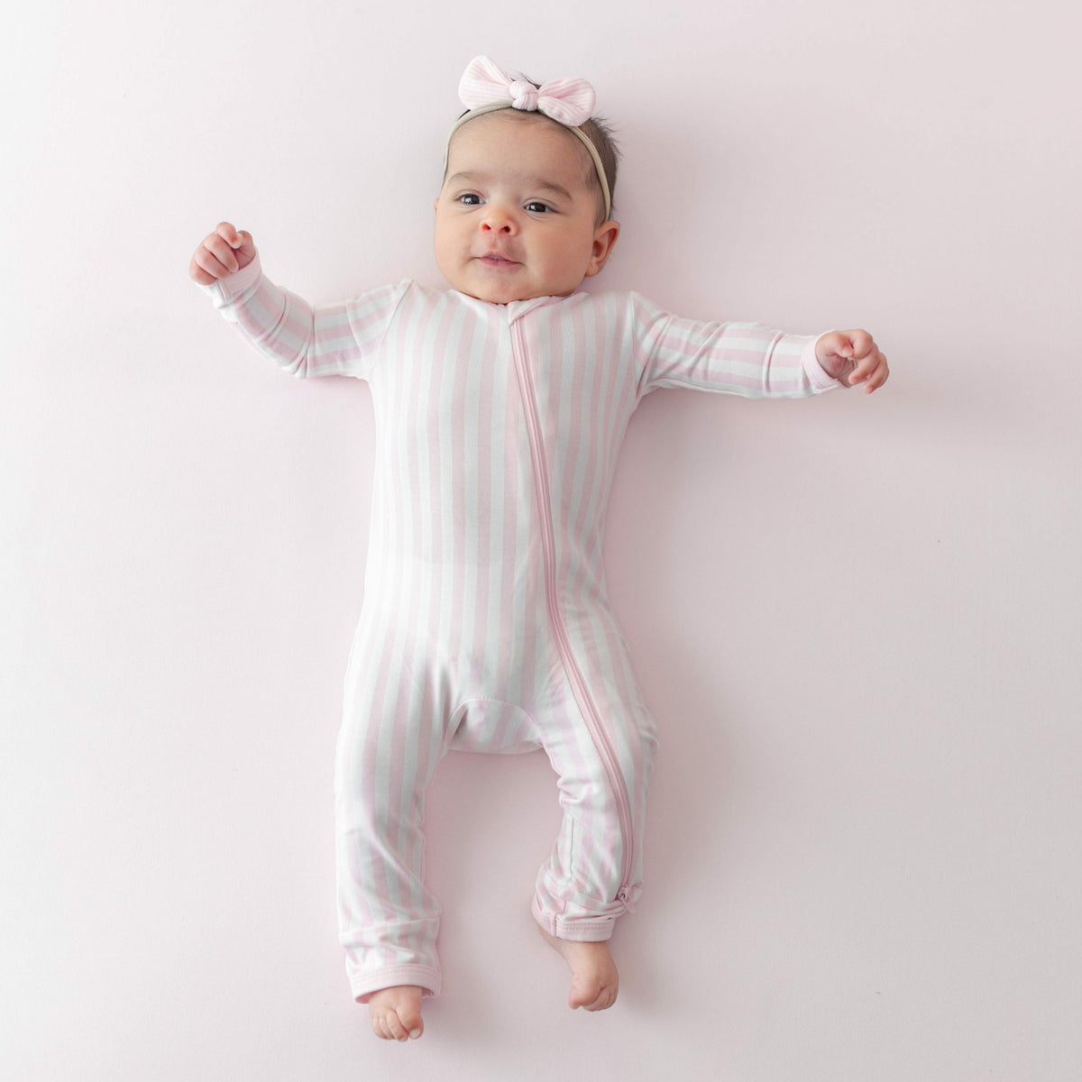 Kyte Baby Zippered Romper in Small Sakura Stripe