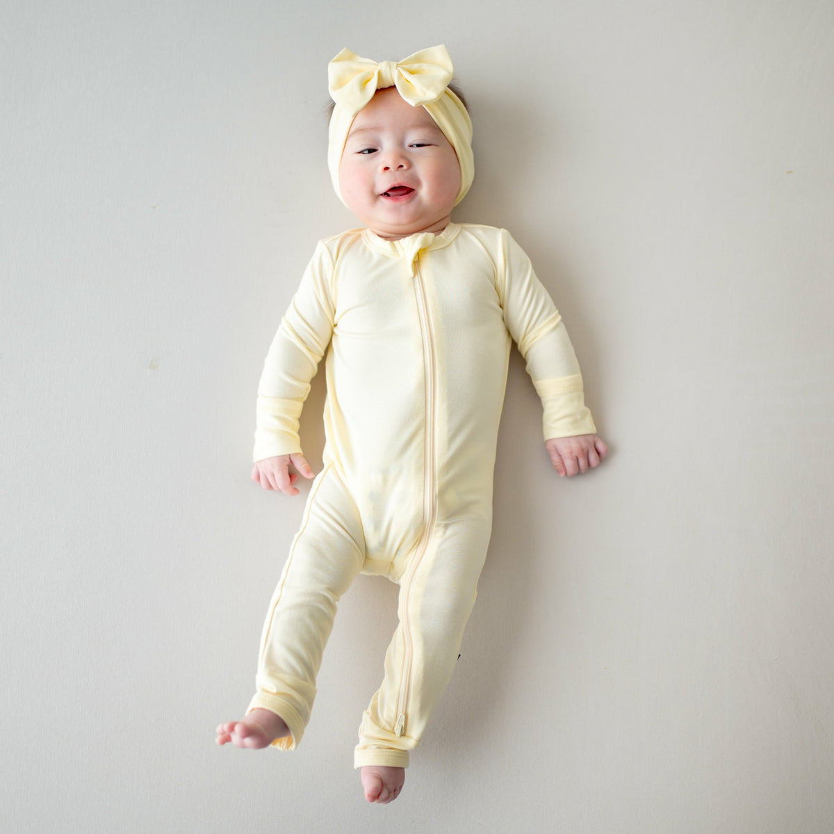 Kyte Baby Zippered Romper in Chamomile