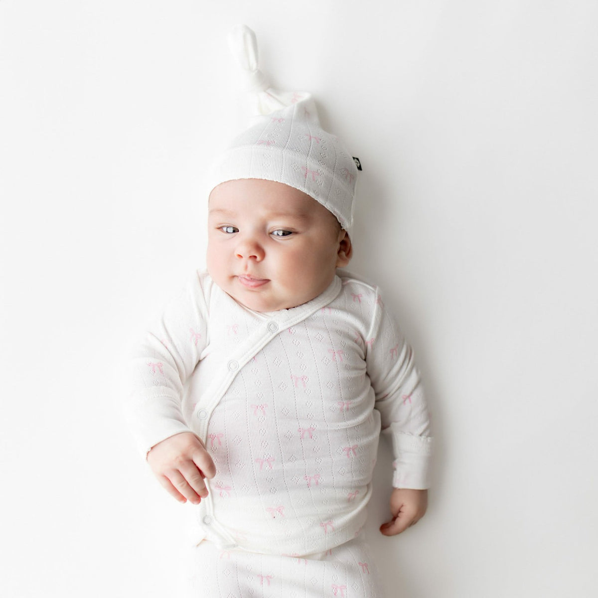 Kyte Baby Pointelle Take Me Home Set with Cap in Sweet Pink Bow