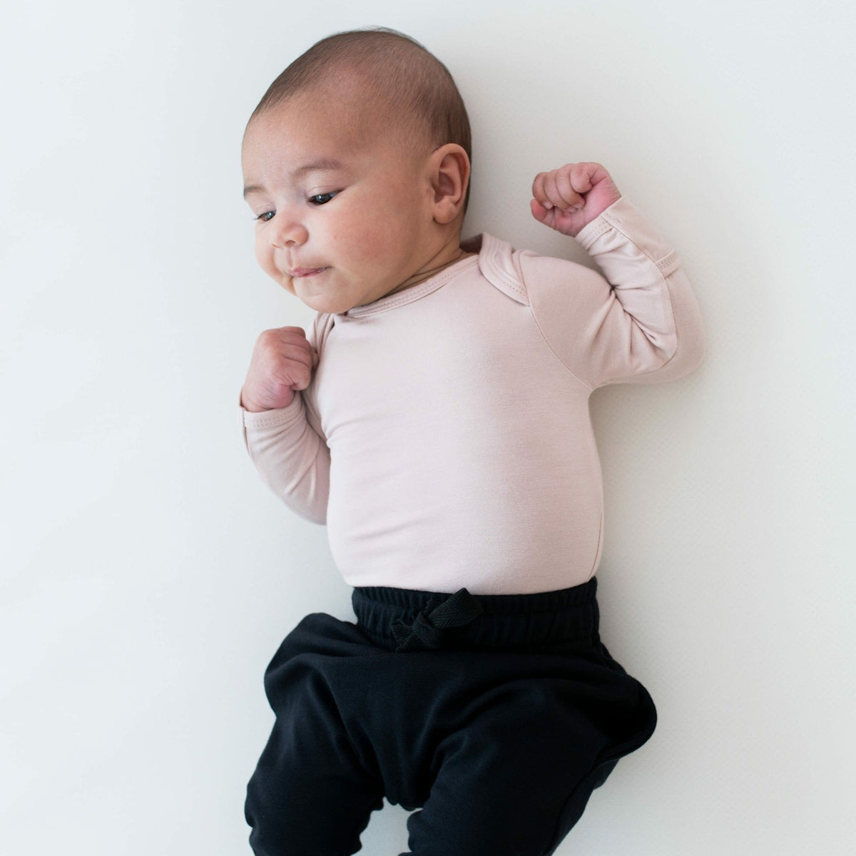 Kyte Baby Long Sleeve Bodysuit in Blush