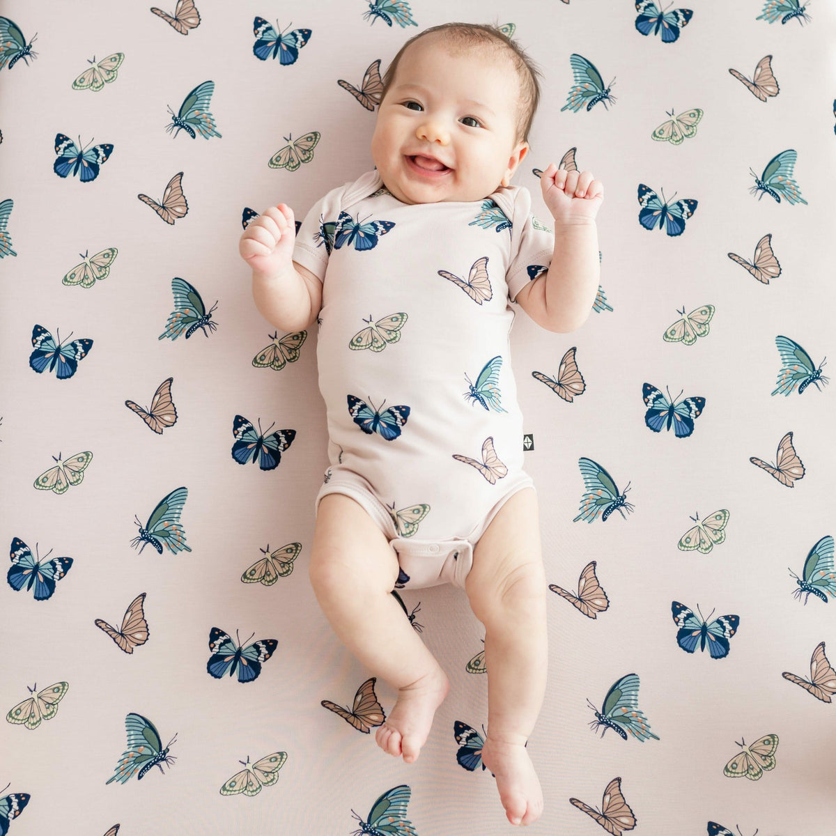 Kyte Baby Bodysuit in Blush Butterfly