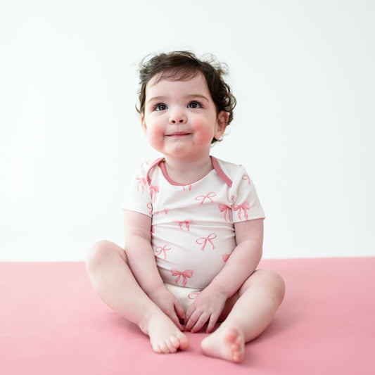 Kyte Baby Bodysuit in Bow