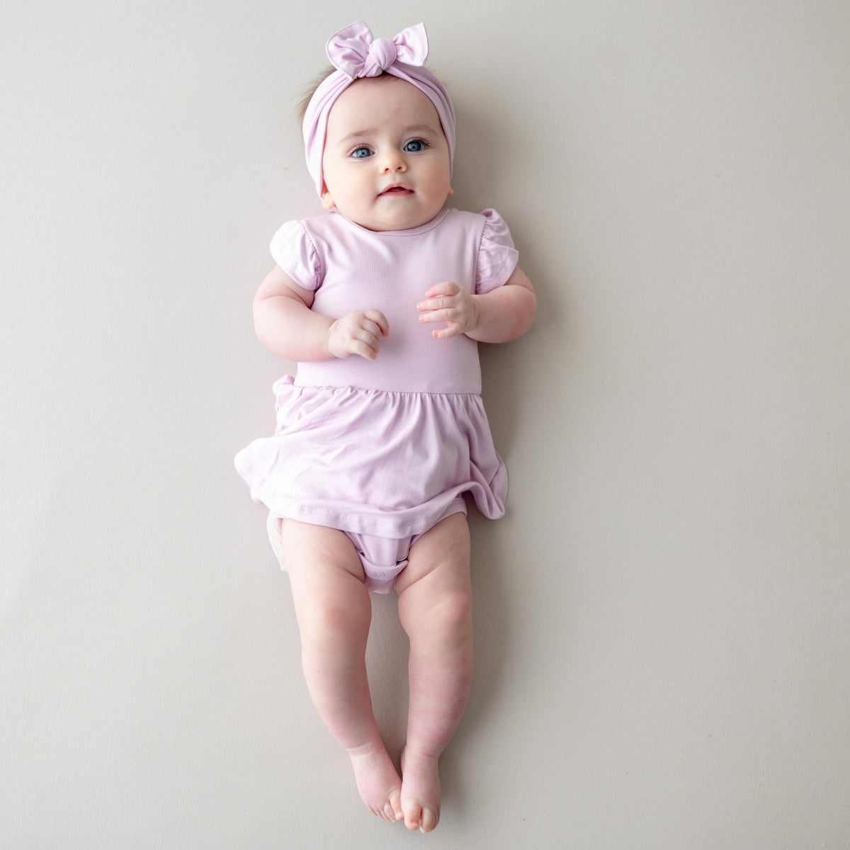 Kyte Baby Twirl Bodysuit Dress in Thistle