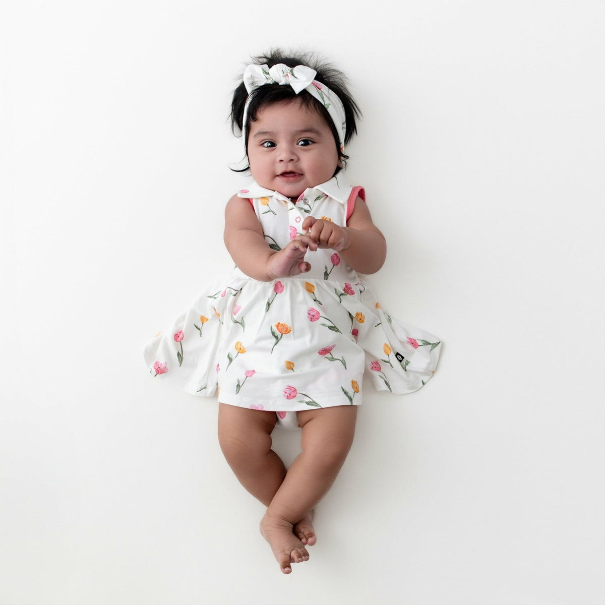 Kyte Baby Polo Bodysuit Dress in Tulip
