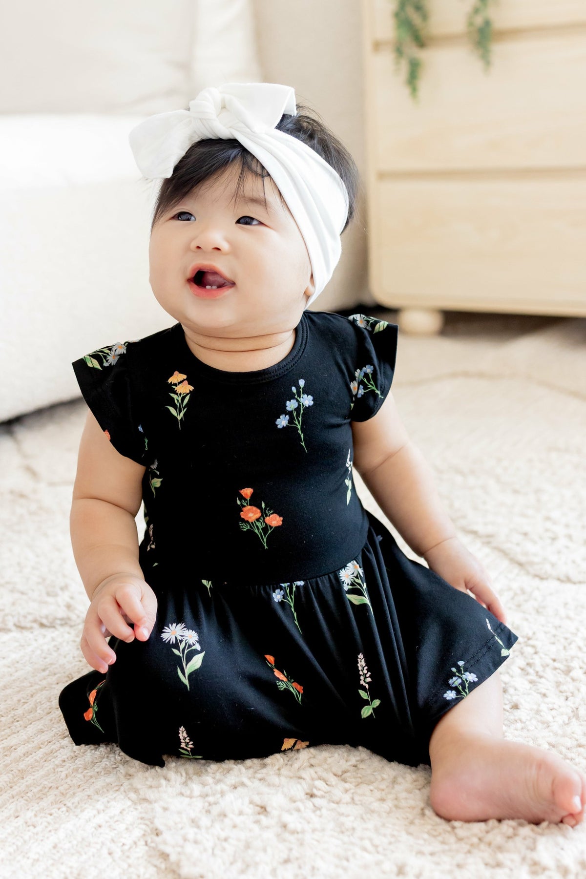 Kyte Baby Twirl Bodysuit Dress in Midnight Wildflower