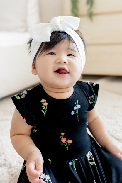 Kyte Baby Twirl Bodysuit Dress in Midnight Wildflower