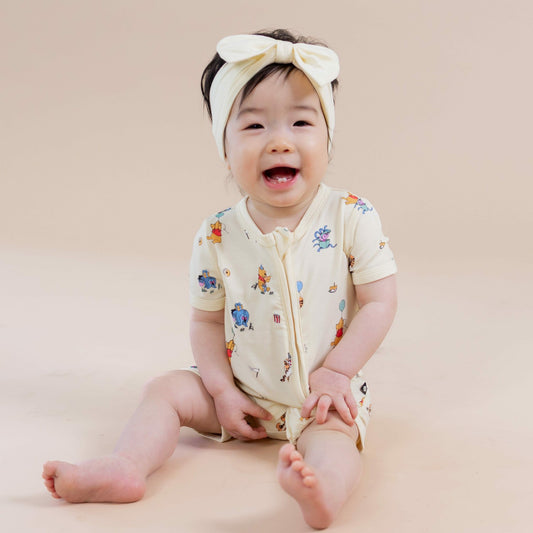 Kyte Baby Zipper Shortall Romper in Winnie the Pooh Celebration