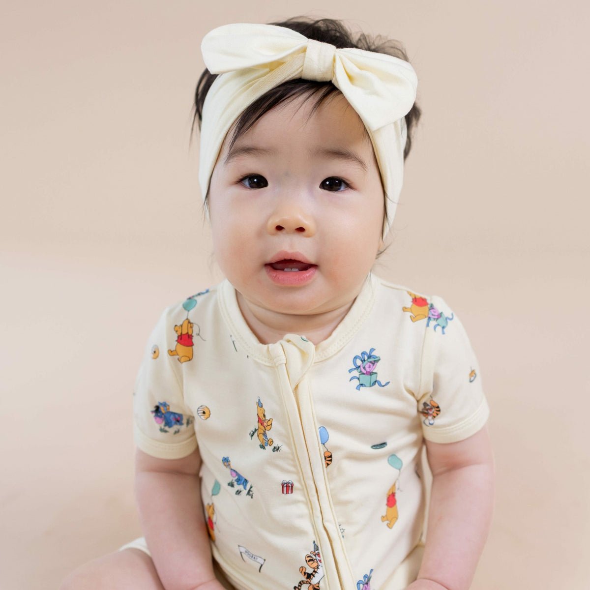 Kyte Baby Zipper Shortall Romper in Winnie the Pooh Celebration