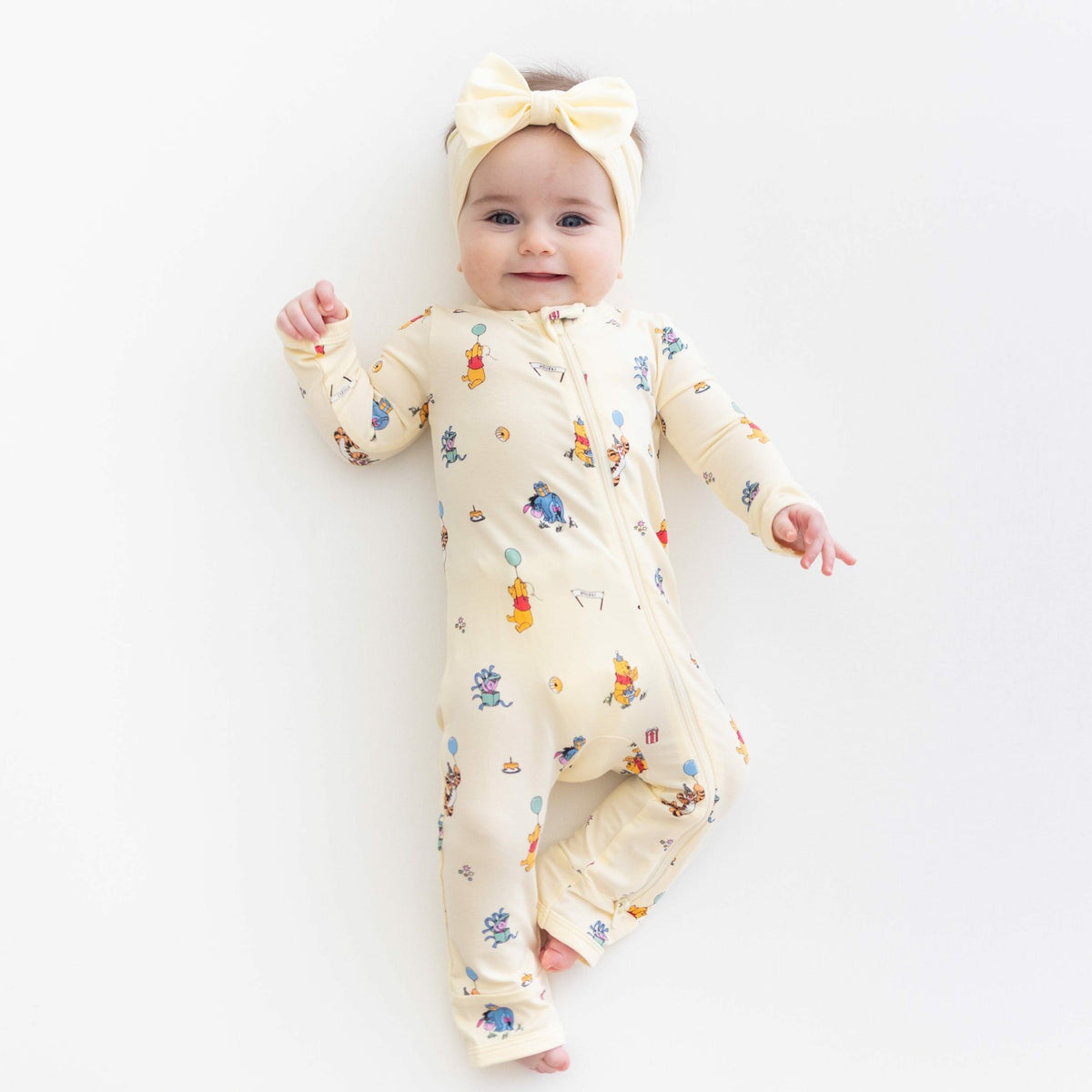Kyte Baby Zippered Romper in Winnie the Pooh Celebration
