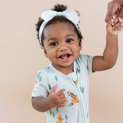 Kyte Baby Zipper Shortall Romper in Winnie the Pooh Hundred Acre Wood
