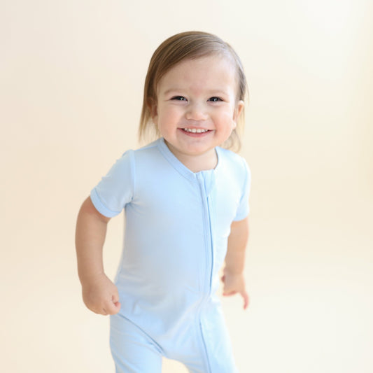 Kyte Baby Zipper Shortall Romper in Breeze