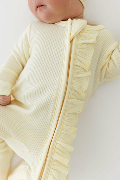 Kyte Baby Ribbed Ruffle Zipper Footie in Chamomile