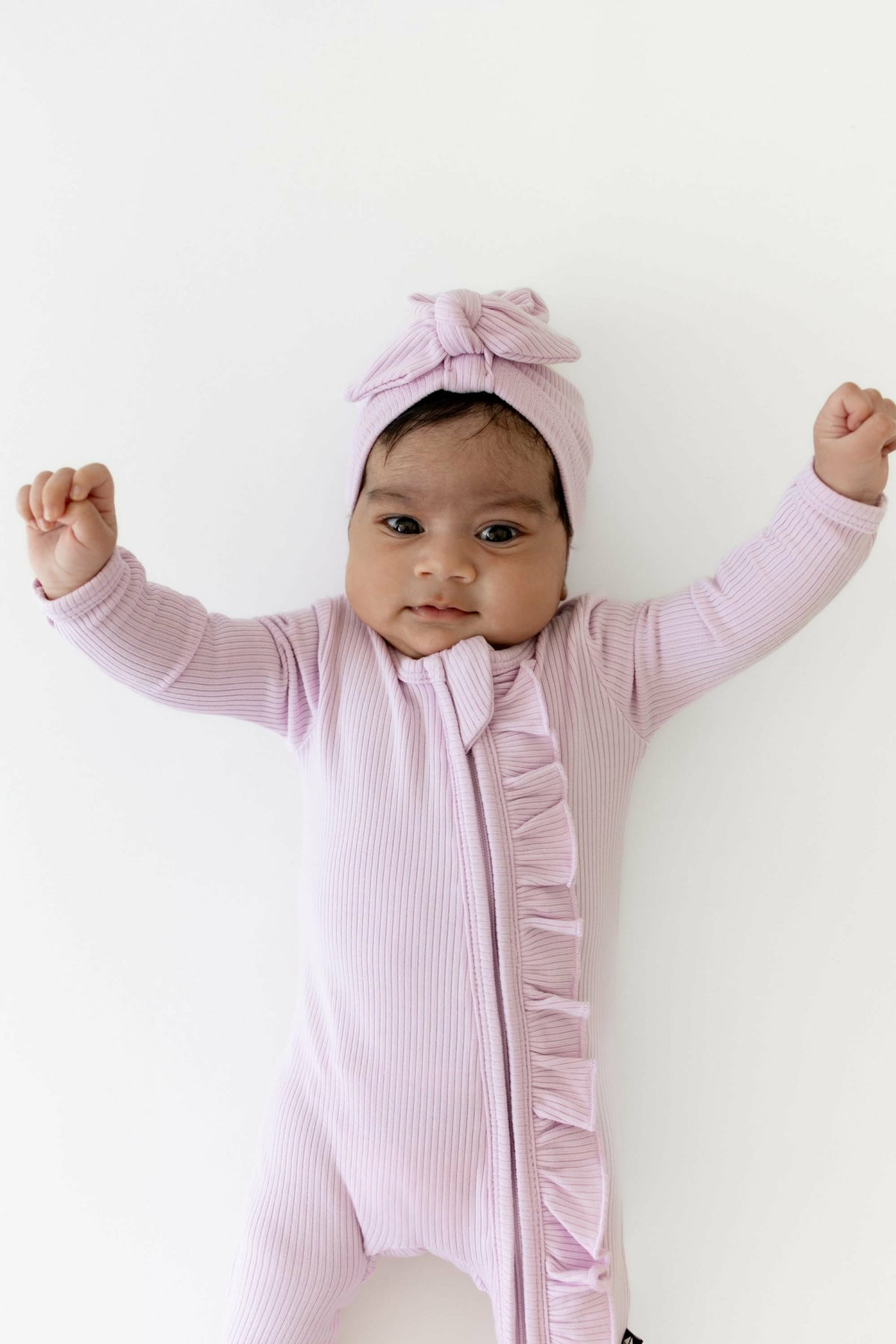 Kyte Baby Ribbed Ruffle Zipper Footie in Thistle