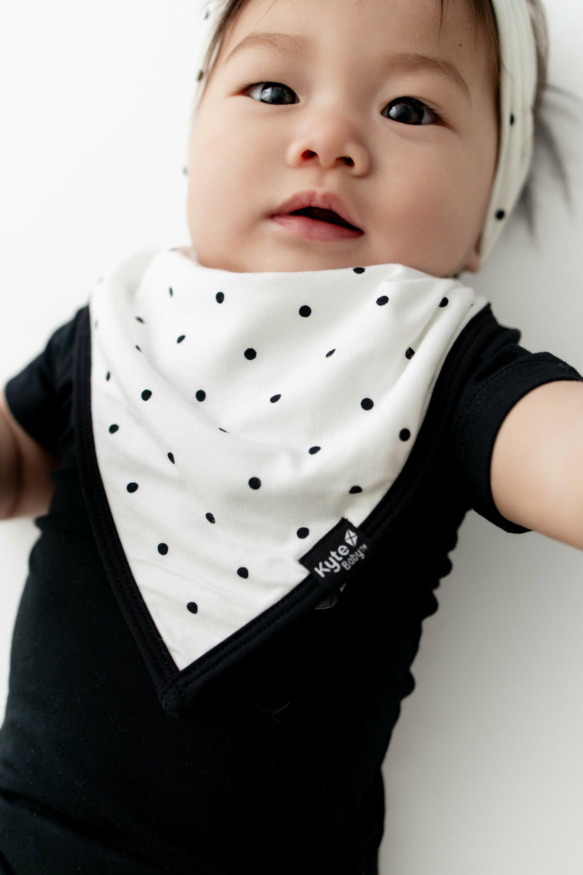 Kyte Baby Bib in Midnight Polka Dot