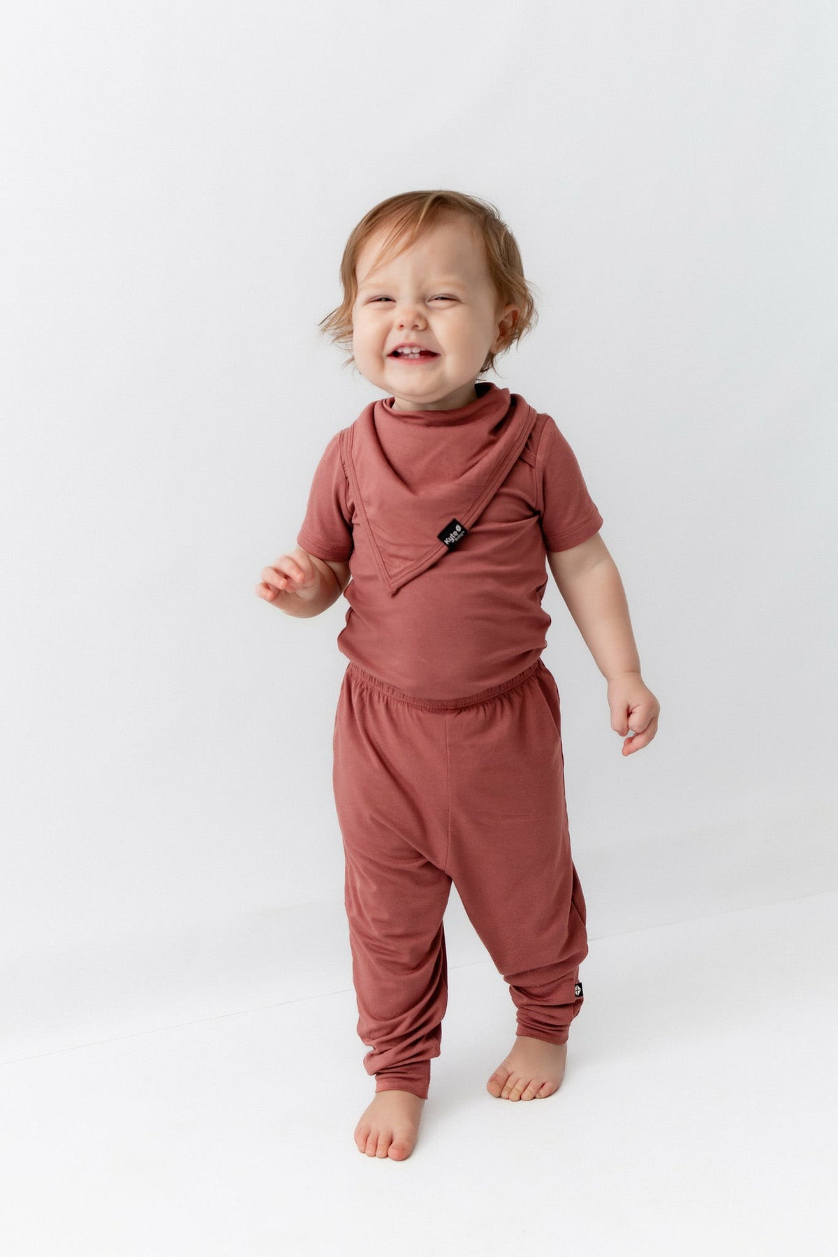 Kyte Baby Bib in Ember