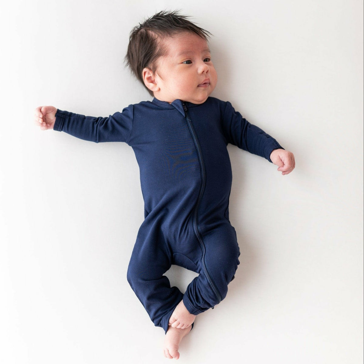 Kyte Baby Zippered Romper in Navy