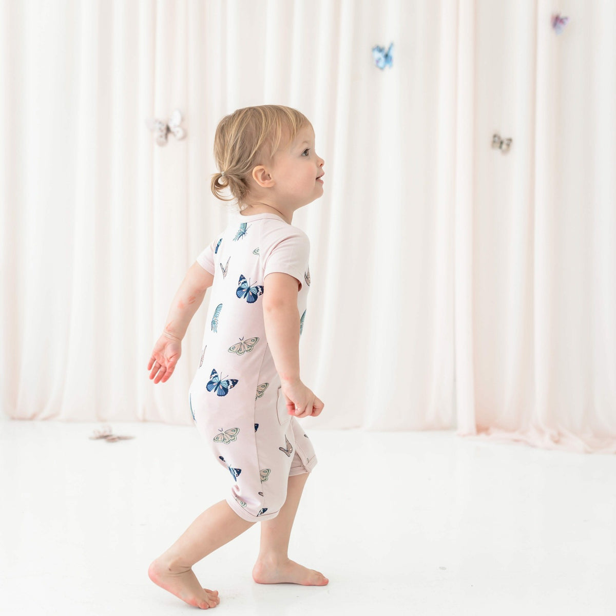 Kyte Baby Shortall in Blush Butterfly