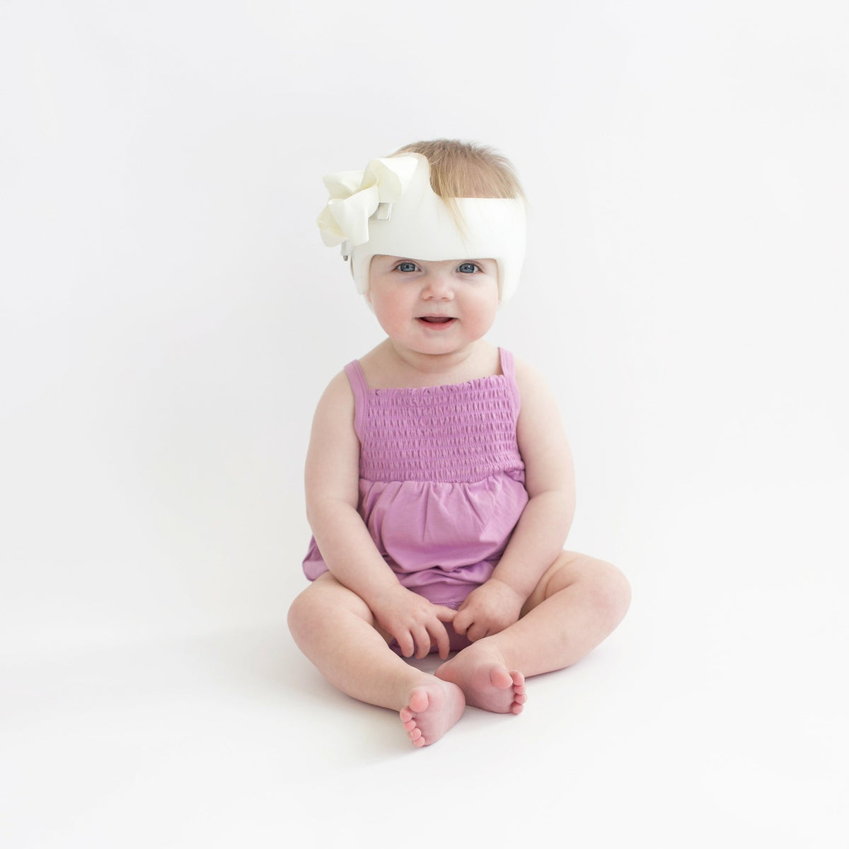 Kyte Baby Smocked Bubble Romper in Poi