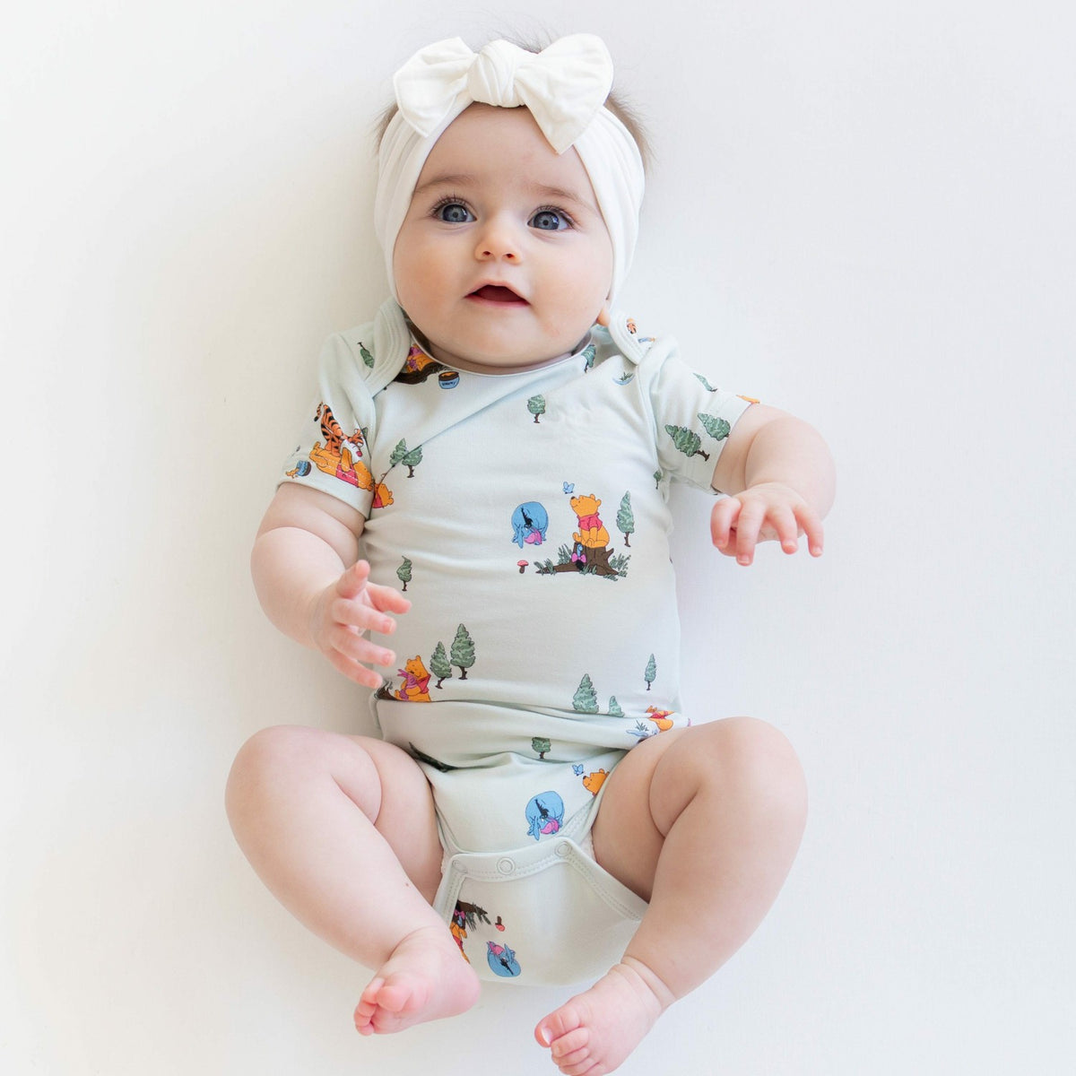 Kyte Baby Bodysuit in Winnie the Pooh Hundred Acre Wood