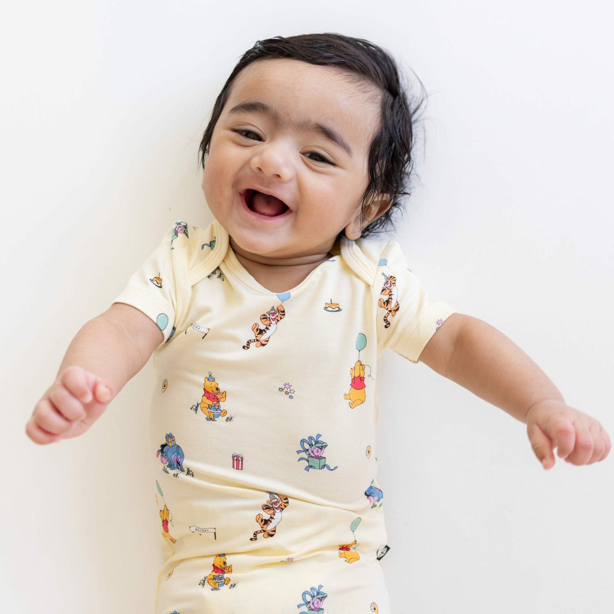 Kyte Baby Bodysuit in Winnie the Pooh Celebration