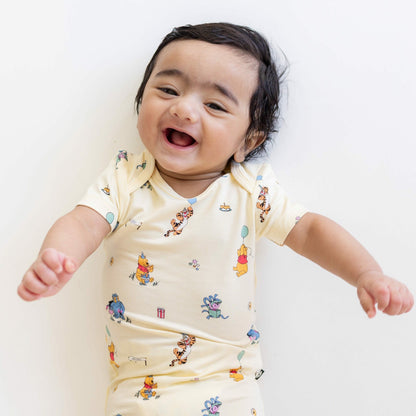 Kyte Baby Bodysuit in Winnie the Pooh Celebration