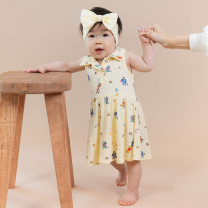 Kyte Baby Polo Bodysuit Dress in Winnie the Pooh Celebration