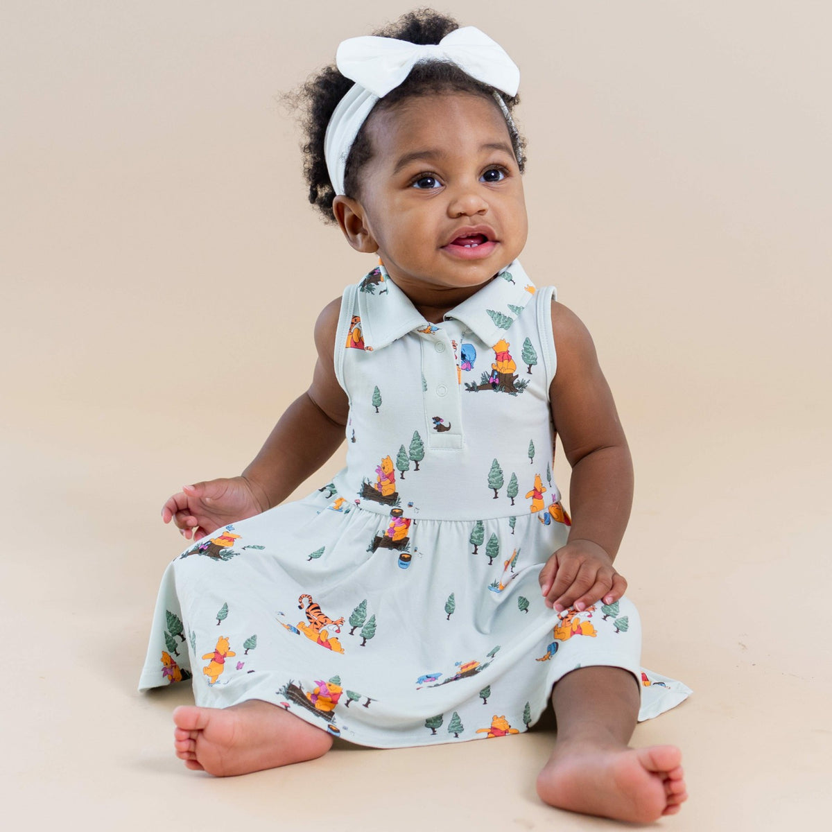 Kyte Baby Polo Bodysuit Dress in Winnie the Pooh Hundred Acre Wood
