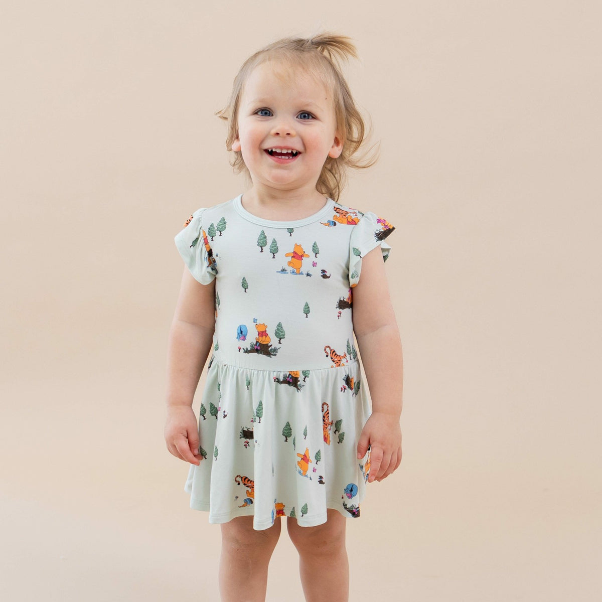 Kyte Baby Twirl Bodysuit Dress in Winnie the Pooh Hundred Acre Wood