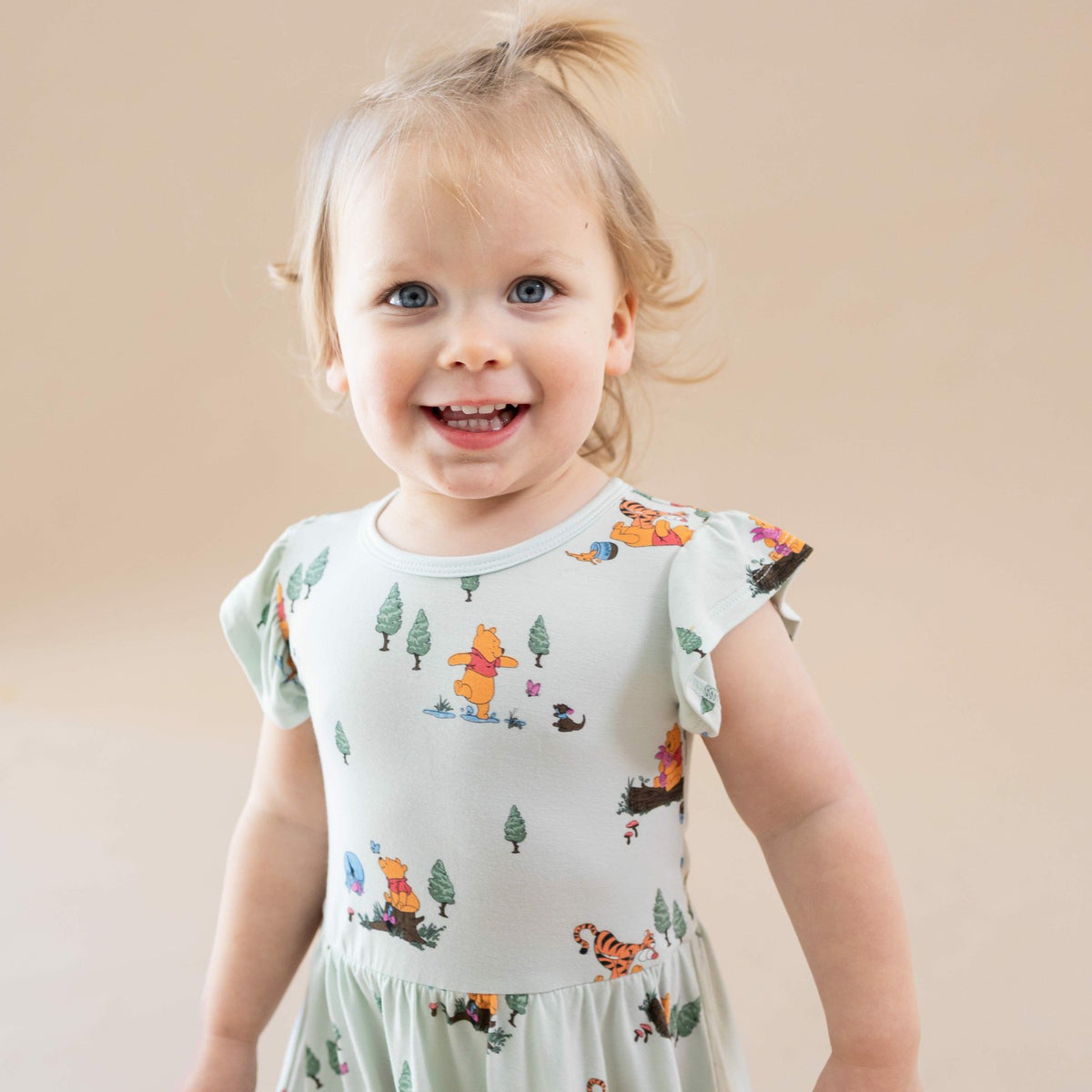 Kyte Baby Twirl Bodysuit Dress in Winnie the Pooh Hundred Acre Wood