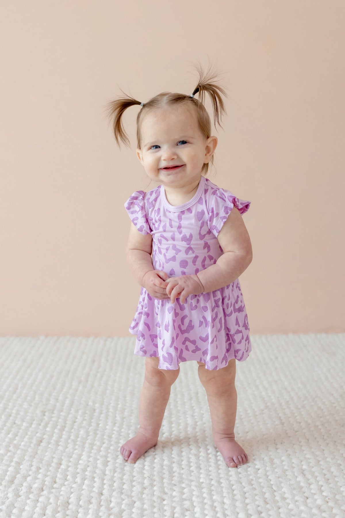 Kyte Baby Twirl Bodysuit Dress in Thistle Leopard